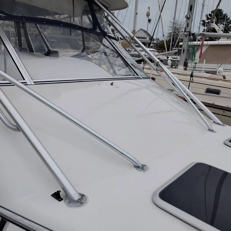 Slide: The Image of Grady-White Express 330 boat, 2004 model, docked at harbor. - 9