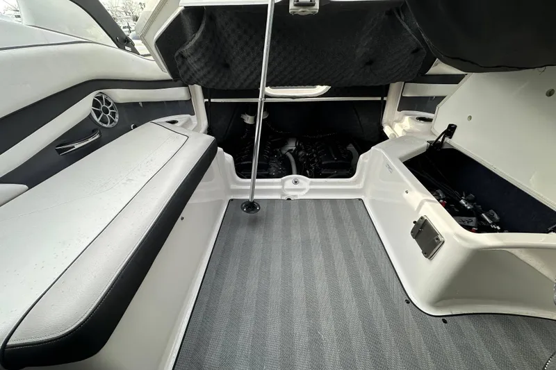 Slide: The Image of 2019 Yamaha Boats 242 Limited S E-Series interior with sleek seating and speakers. - 24