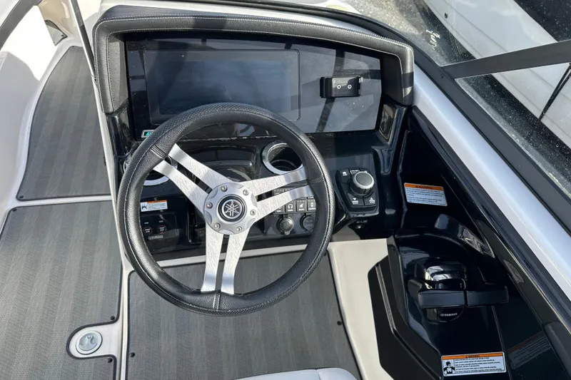 Slide: The Image of 2019 Yamaha Boats 242 Limited S E-Series dashboard with steering wheel and controls. - 27