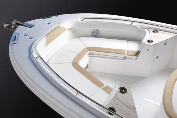 Slide: The Image of 2026 Edgewater 262CC boat interior with cushioned seating and cup holders. - 12