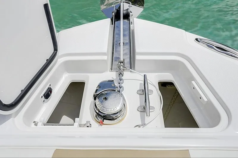 Slide: The Image of Anchor compartment of 2026 Edgewater 262CC boat with winch and cleat. - 6
