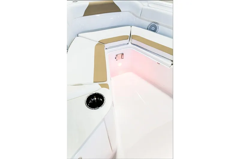 Slide: The Image of 2026 Edgewater 262CC boat interior with cushioned seating and cup holder. - 7