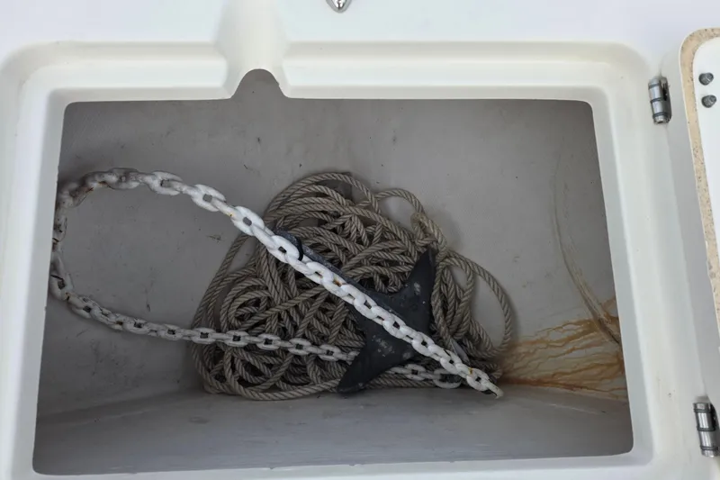 Slide: The Image of Anchor and rope storage in 2021 Cobia 237 Center Console boat compartment. - 15