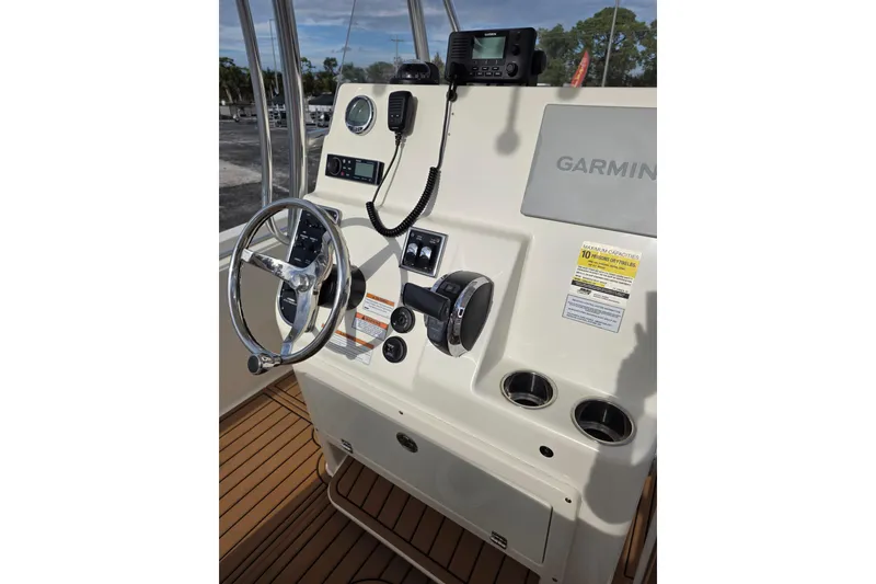 Slide: The Image of 2021 Cobia 237 Center Console boat dashboard with Garmin navigation system. - 17