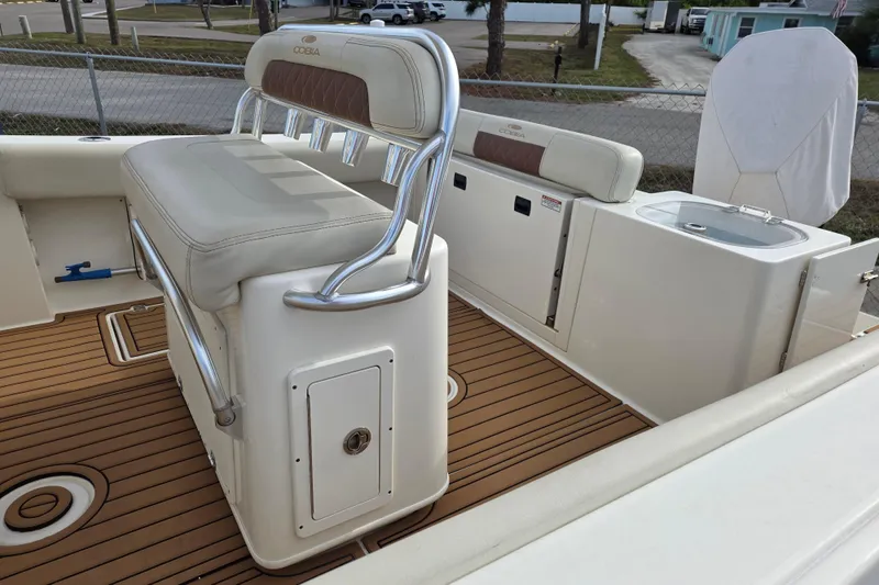 Slide: The Image of 2021 Cobia 237 Center Console boat interior with seating and storage features. - 6