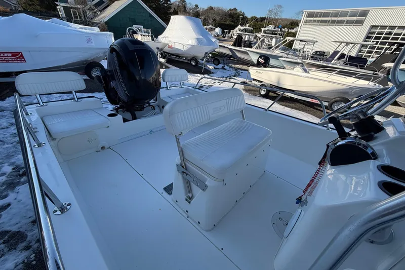 Slide: The Image of 2018 Boston Whaler 190 Montauk boat interior with steering wheel and seating. - 13