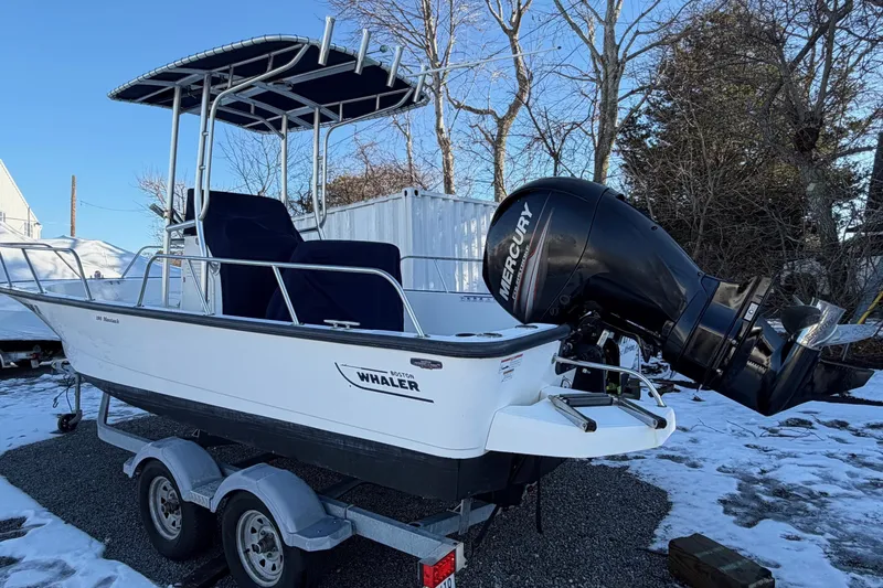 Slide: The Image of 2018 Boston Whaler 190 Montauk boat with Mercury engine on trailer. - 2