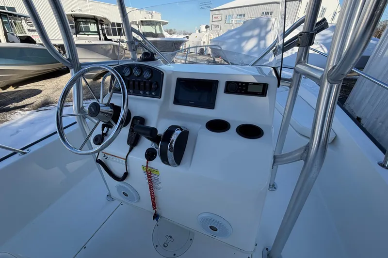 Slide: The Image of 2018 Boston Whaler 190 Montauk boat console with steering wheel and controls. - 20