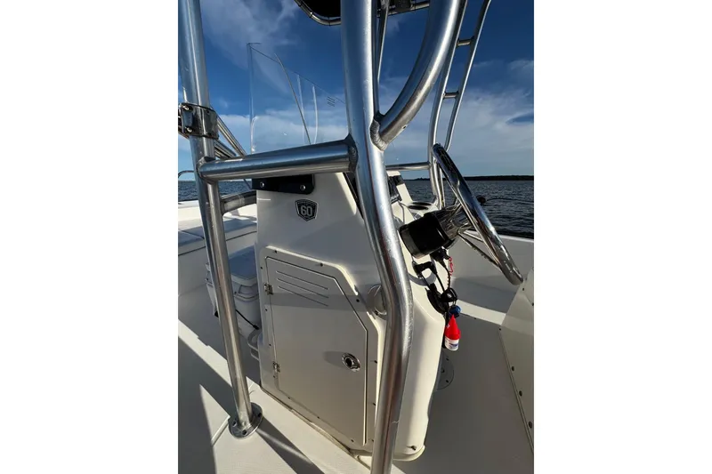 Slide: The Image of 2018 Boston Whaler 190 Montauk boat interior with seating and storage compartments. - 24