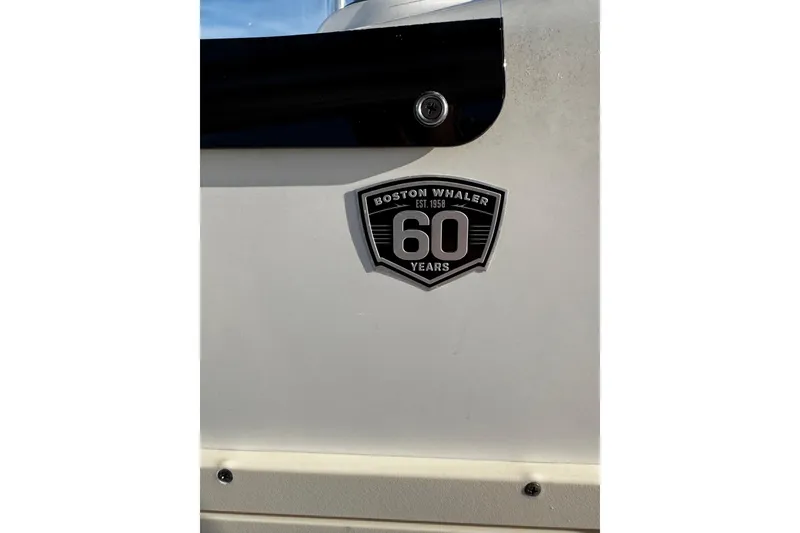 Slide: The Image of 2018 Boston Whaler 190 Montauk boat console with steering wheel and stainless steel frame. - 25