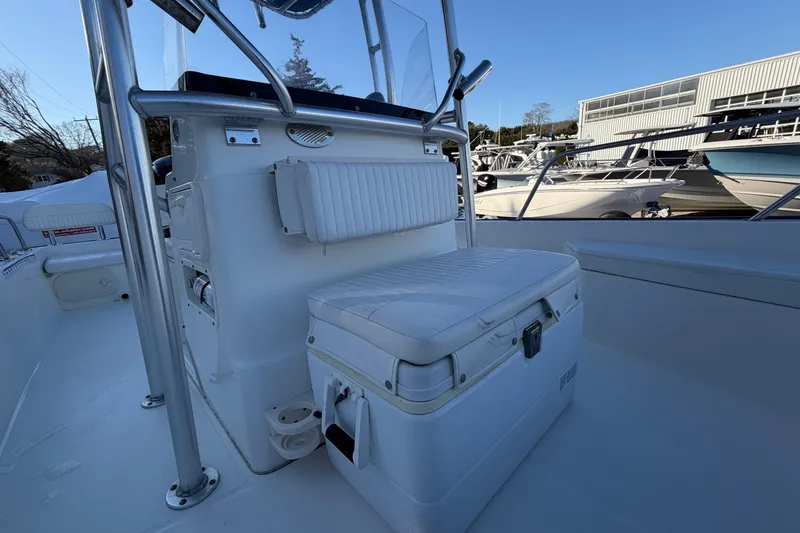 Slide: The Image of 2018 Boston Whaler 190 Montauk boat with T-top on calm water. - 29