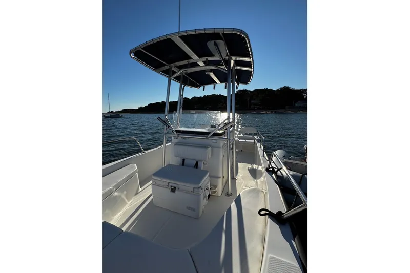 Slide: The Image of 2018 Boston Whaler 190 Montauk boat interior with seating and console. - 30