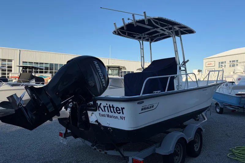 Slide: The Image of 2018 Boston Whaler 190 Montauk boat with Mercury engine on trailer. - 43