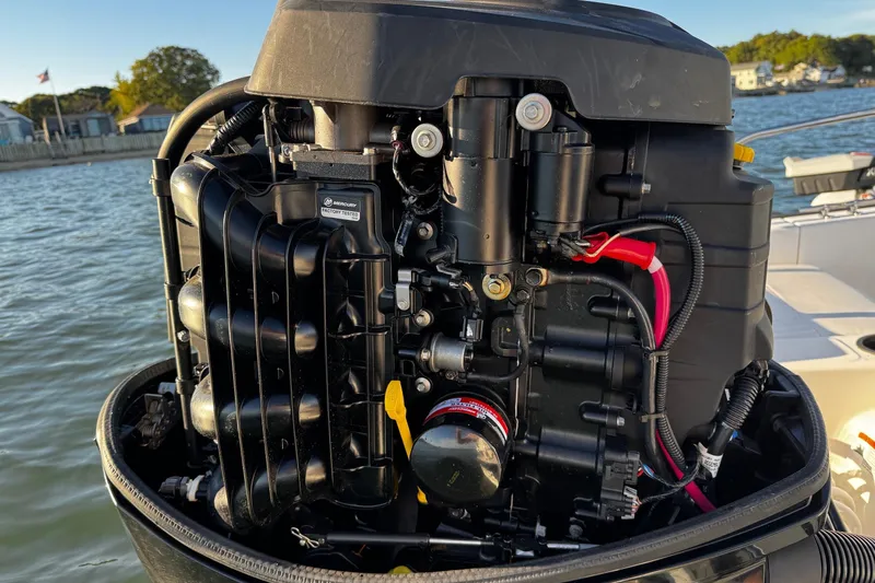 Slide: The Image of 2018 Boston Whaler 190 Montauk boat interior with Mercury engine and seating. - 7