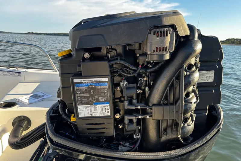 Slide: The Image of 2018 Boston Whaler 190 Montauk boat interior with seating and Mercury outboard motor. - 8