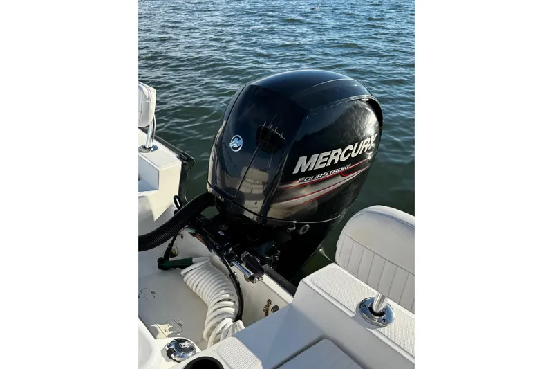Slide: The Image of 2018 Boston Whaler 190 Montauk boat interior with seating and steering console. - 9