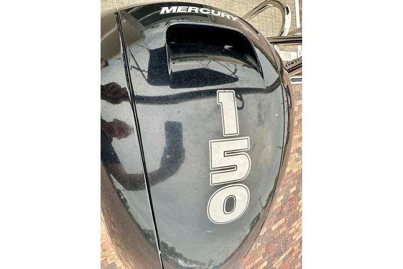 Slide: The Image of 2023 Harris Cruiser 230 with Mercury 150 outboard engine. - 13