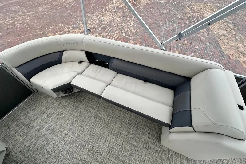 Slide: The Image of 2023 Harris Cruiser 230 boat interior with plush seating and modern design. - 29
