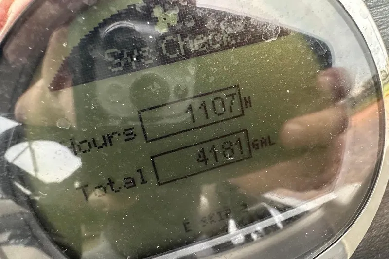 Slide: The Image of Close-up of a 2023 Harris Cruiser 230 dashboard showing 1107 hours and 4181 gallons. - 35