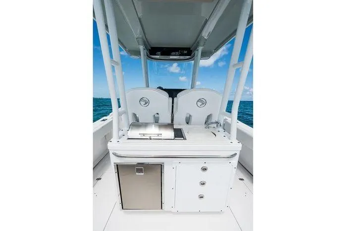 Slide: The Image of 2026 Edgewater 285CC boat interior with modern amenities and ocean view. - 14