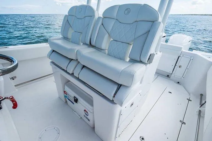 Slide: The Image of 2026 Edgewater 285CC boat interior with luxurious seating and ocean view. - 7