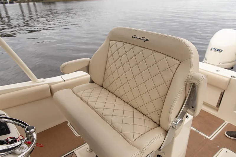 Slide: The Image of Luxurious seating on 2016 Chris-Craft Catalina 26 boat with diamond-stitched upholstery. - 18
