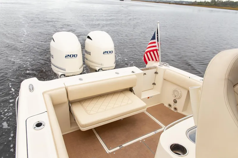 Slide: The Image of 2016 Chris-Craft Catalina 26 boat with twin Yamaha 200 engines and American flag. - 21