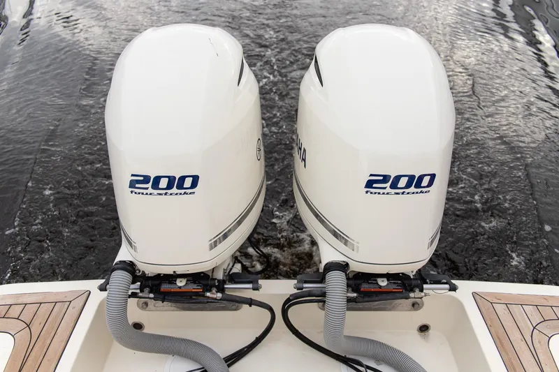 Slide: The Image of Twin Yamaha 200 four-stroke engines on a 2016 Chris-Craft Catalina 26 boat. - 23