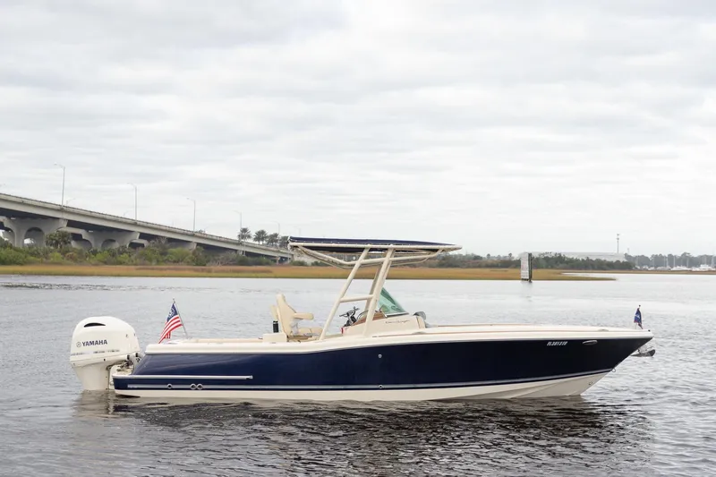Slide: The Image of 2016 Chris-Craft Catalina 26 boat on water, featuring Yamaha engine and American flag. - 5