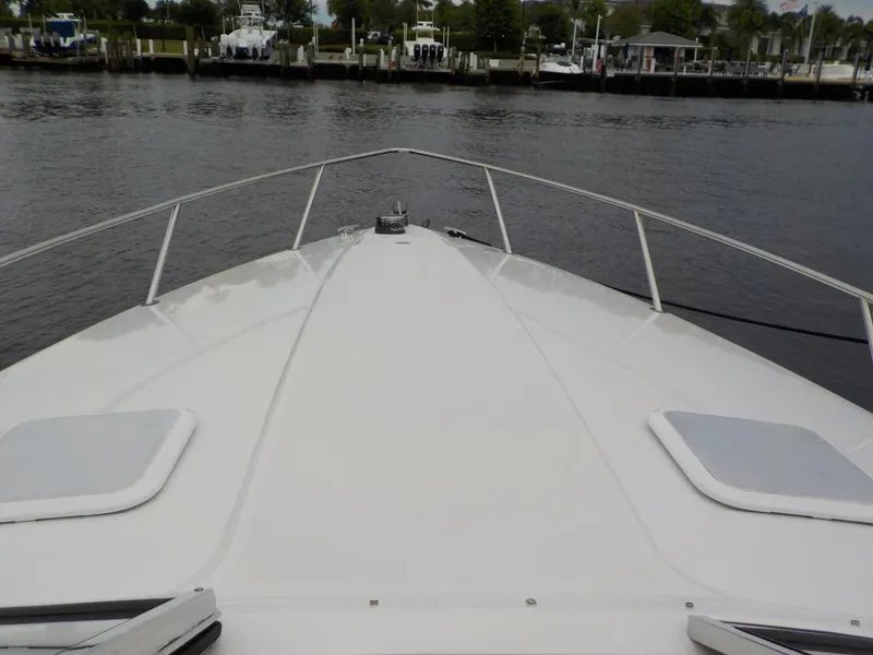 Slide: The Image of 2006 Formula 330 SS boat bow on calm water near marina. - 11
