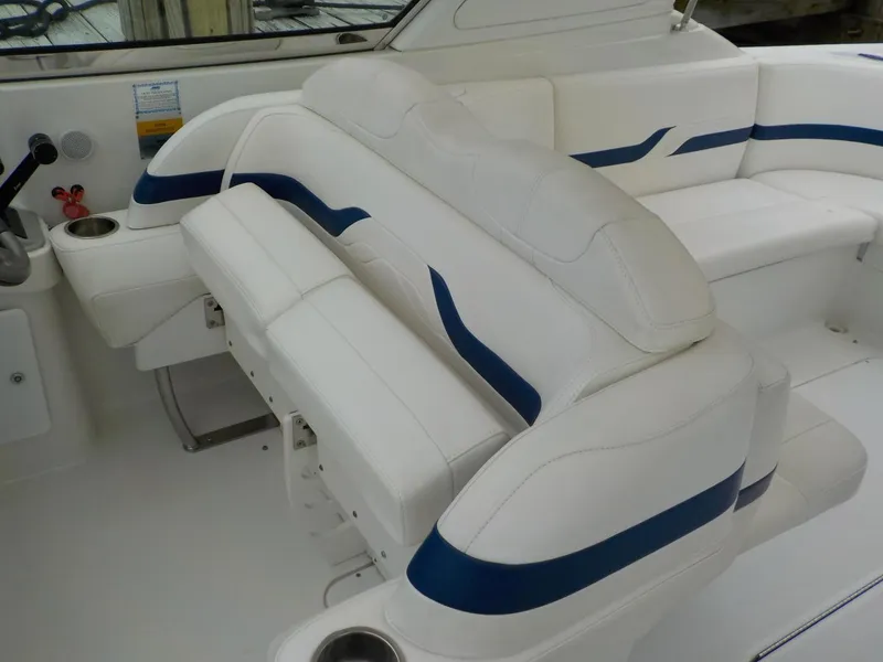 Slide: The Image of 2006 Formula 330 SS boat interior with white and blue seating. - 6