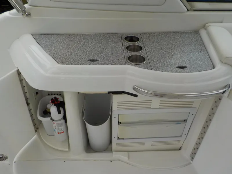 Slide: The Image of 2006 Formula 330 SS boat interior with countertop and storage compartments. - 7