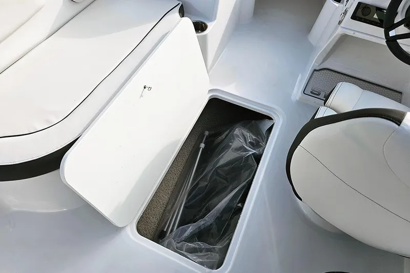 Slide: The Image of 2026 Stingray 182 SC boat interior with open storage compartment and seating. - 19