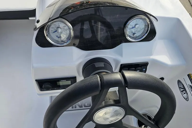 Slide: The Image of 2026 Stingray 182 SC boat dashboard with steering wheel and gauges. - 21