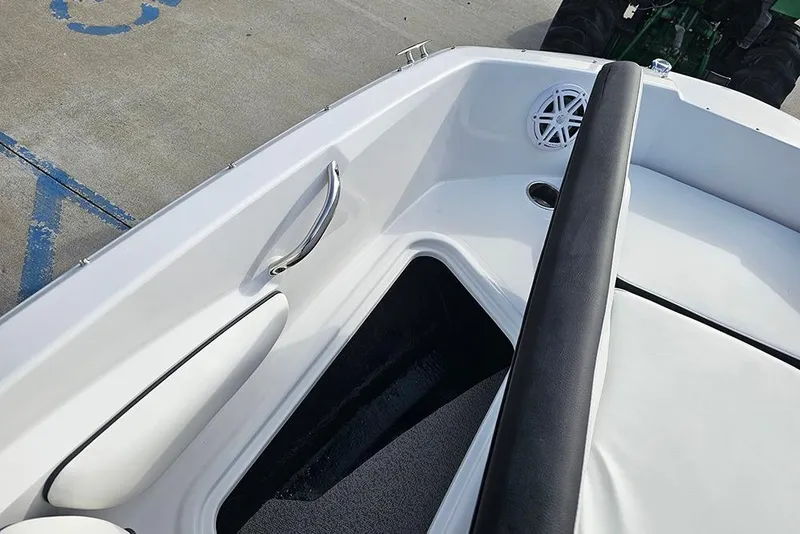 Slide: The Image of 2026 Stingray 182 SC boat interior with seating, speaker, and handle details. - 23