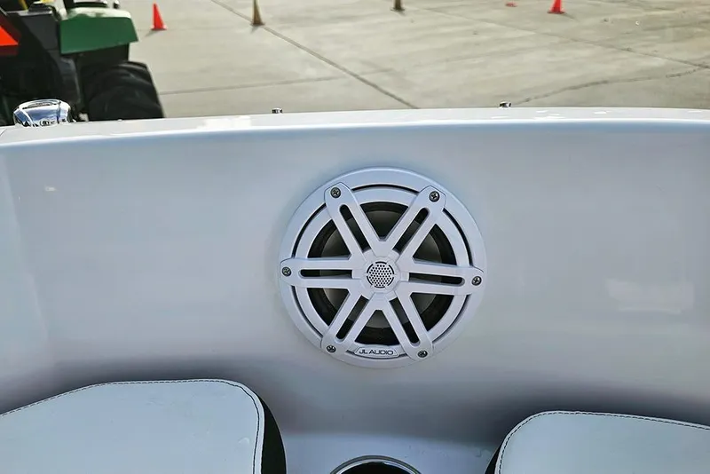 Slide: The Image of 2026 Stingray 182 SC boat with JL Audio speaker on white interior panel. - 24