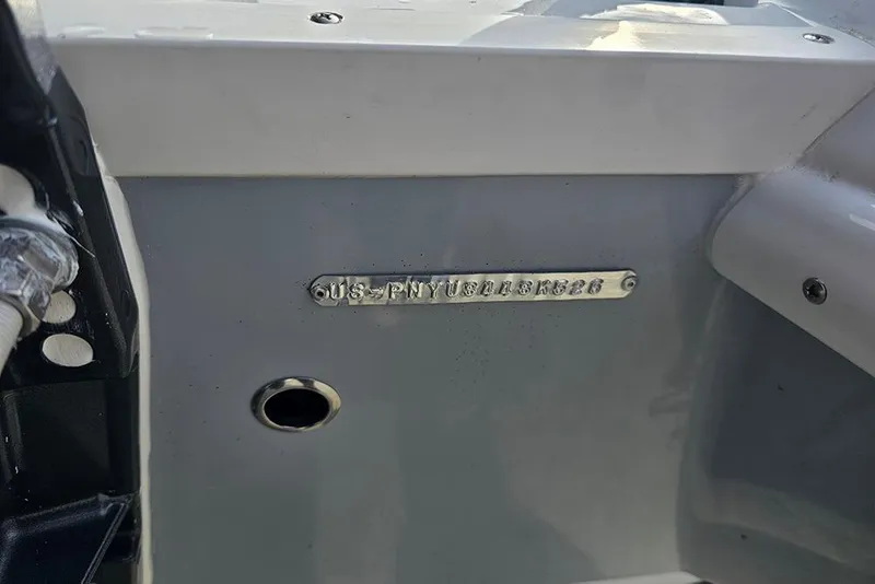 Slide: The Image of 2026 Stingray 182 SC boat hull identification number plate close-up. - 25