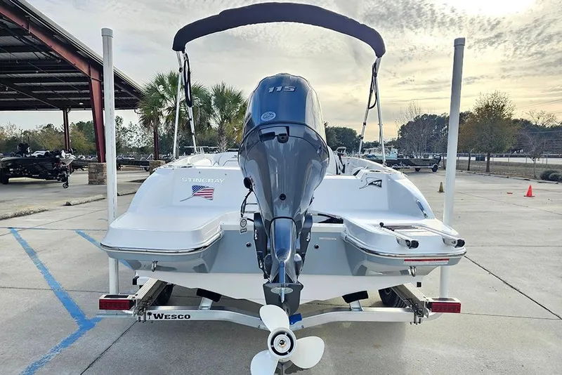 Slide: The Image of 2026 Stingray 182 SC boat on trailer, rear view with outboard motor. - 9