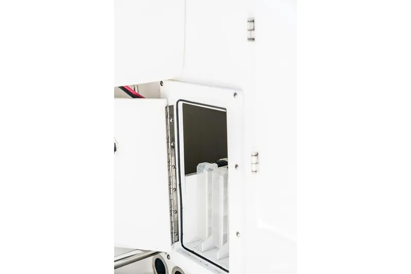 Slide: The Image of Open storage compartment on 2026 Edgewater 325CC boat, showcasing interior details. - 10