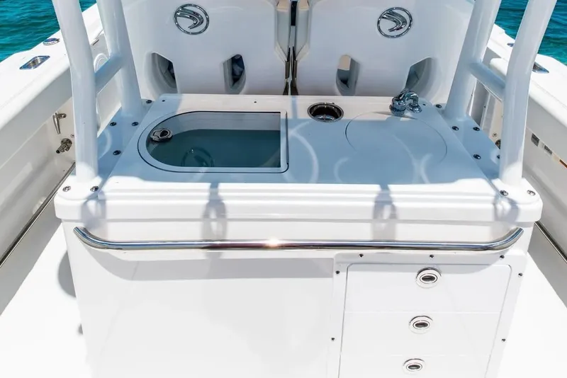 Slide: The Image of 2026 Edgewater 325CC boat console with storage and sink, featuring sleek design and functionality. - 18