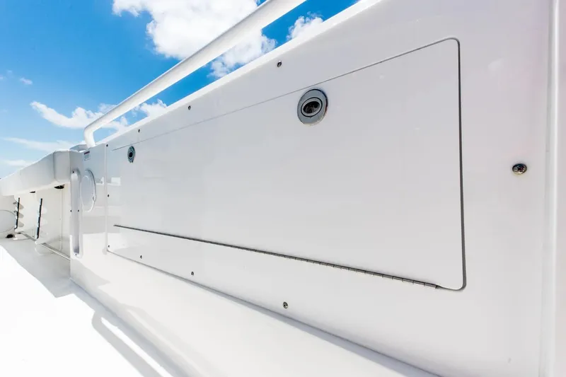 Slide: The Image of 2026 Edgewater 325CC boat detail against a bright blue sky. - 7