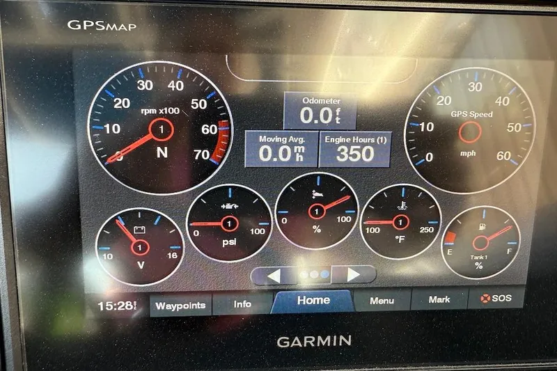 Slide: The Image of Dashboard display of a 2021 Cobalt R3 Surf boat with various gauges and readings. - 12