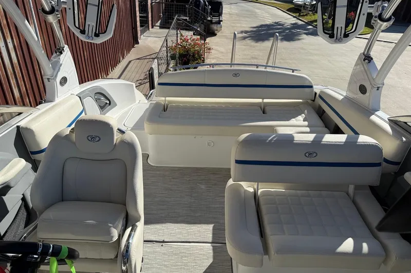 Slide: The Image of 2021 Cobalt R3 Surf boat interior with white seating and blue accents. - 15