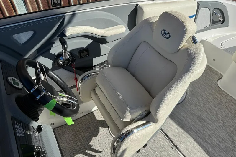 Slide: The Image of 2021 Cobalt R3 Surf boat interior with steering wheel and captain's chair. - 16