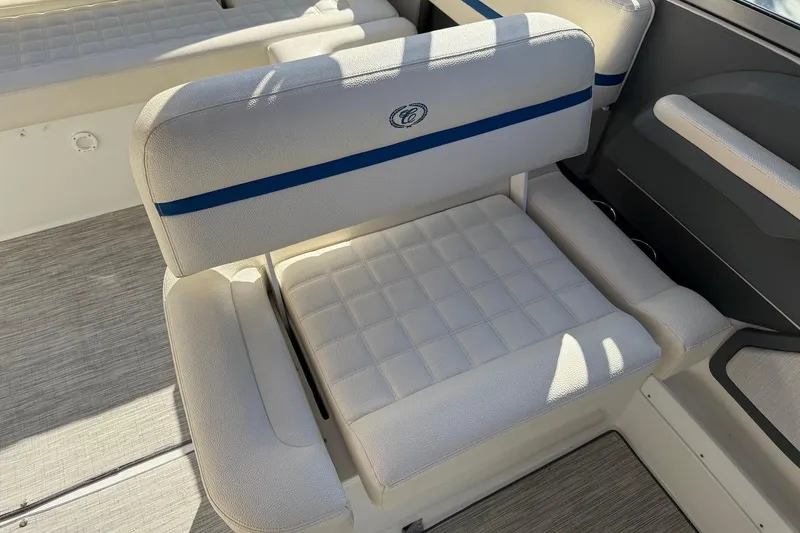 Slide: The Image of 2021 Cobalt R3 Surf boat interior with cushioned seating and elegant design. - 17