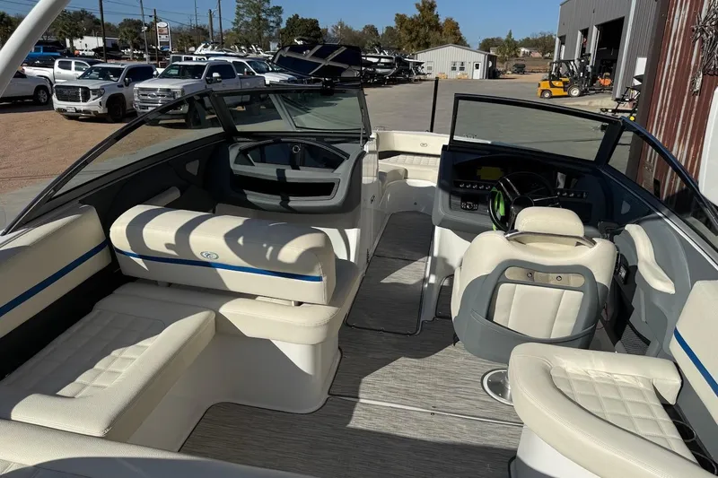 Slide: The Image of 2021 Cobalt R3 Surf boat interior with luxurious seating and modern dashboard. - 5