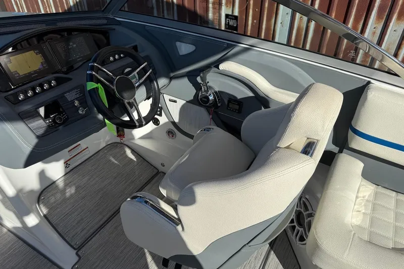 Slide: The Image of 2021 Cobalt R3 Surf boat interior with steering wheel and dashboard controls. - 8