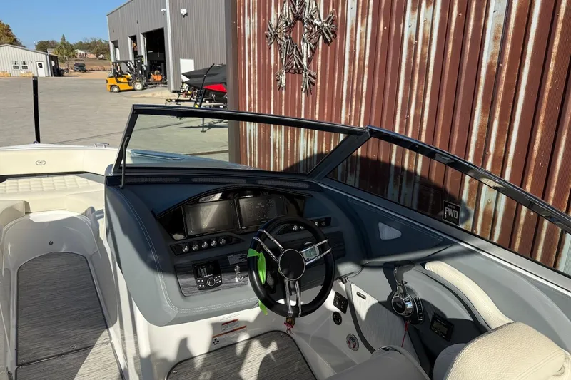 Slide: The Image of 2021 Cobalt R3 Surf boat interior with modern dashboard and steering wheel. - 9