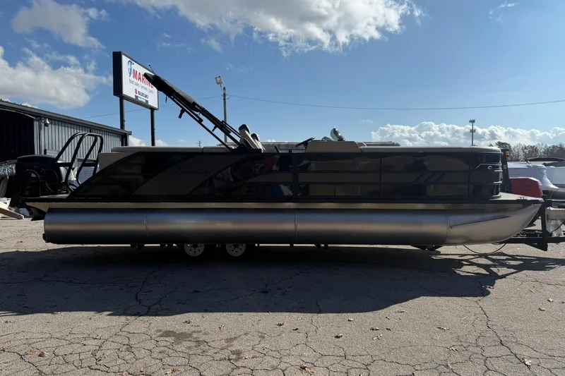 Slide: The Image of 2026 Bentley Pontoons Elite 253 Admiral pontoon boat parked outdoors. - 1