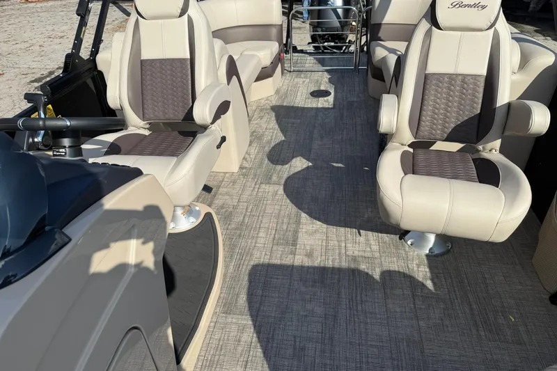 Slide: The Image of 2026 Bentley Pontoons Elite 253 Admiral interior with luxurious seating and modern design. - 12